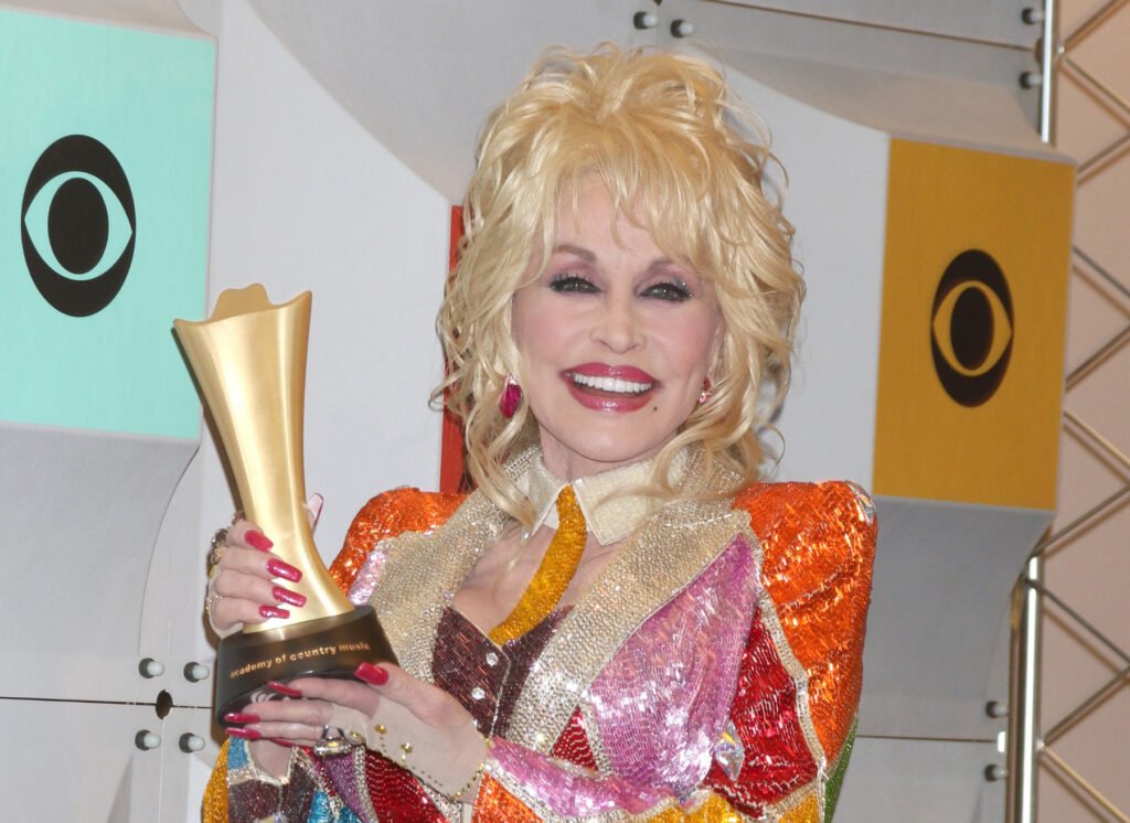 Why Does Dolly Parton Wear Gloves? (The Truth Revealed)